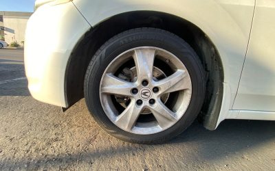 Why does the Acura front suspension knock after sharp left turns?