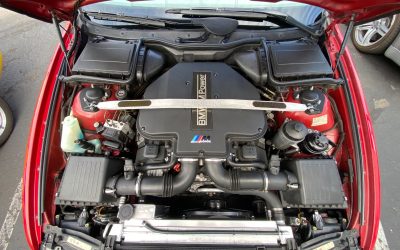 What makes a BMW turbo engine produce a faint metallic chirp?